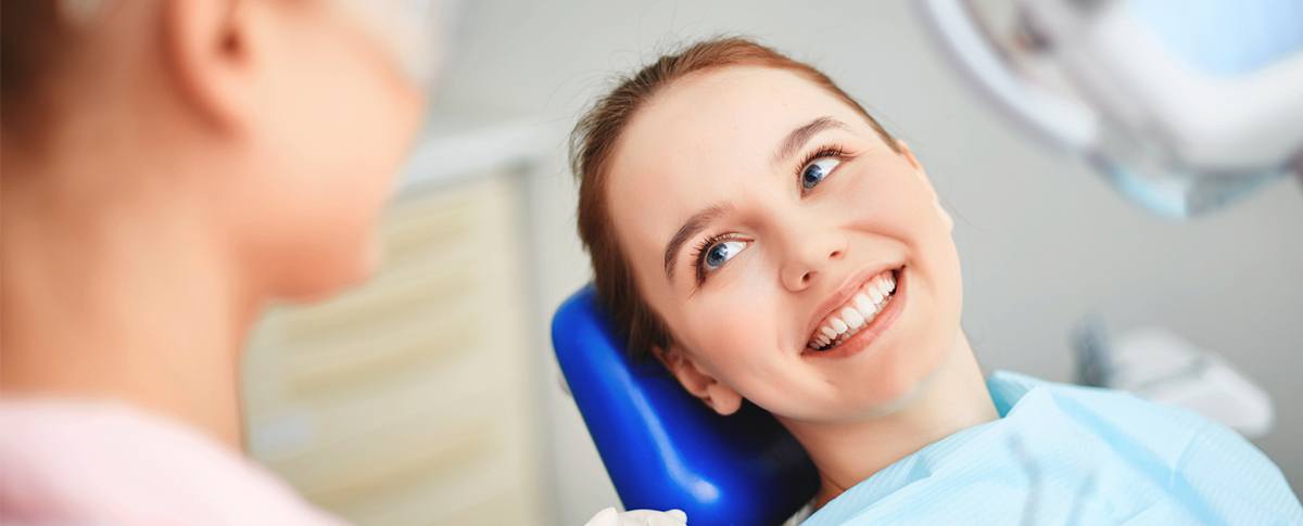 Smiling woman in dental chair