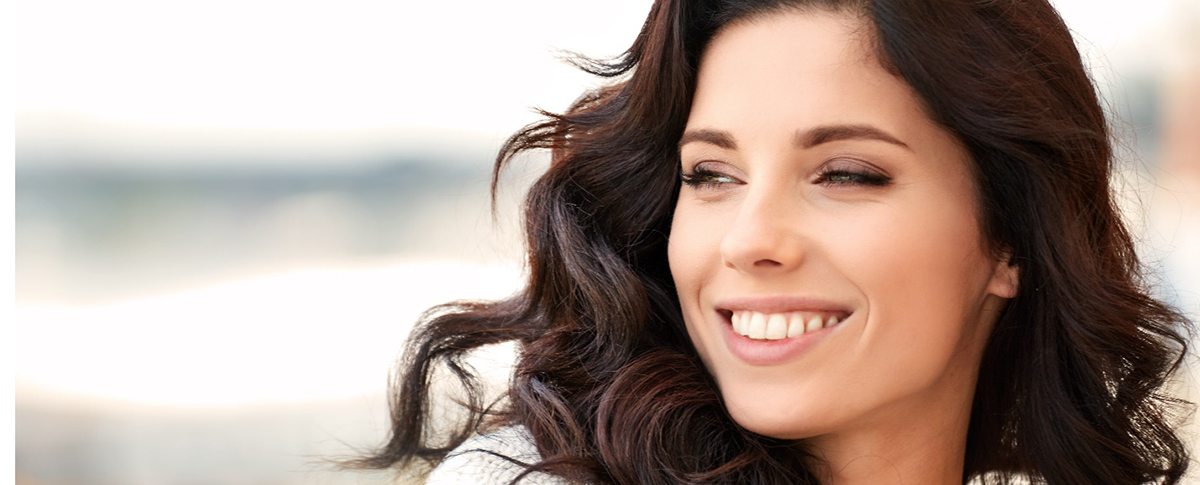 a woman in Kingwood smiling after undergoing dental bonding