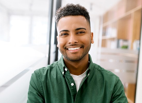 a man smiling after undergoing dental bonding in Kingwood