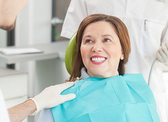 Smiling older woman in dental chair