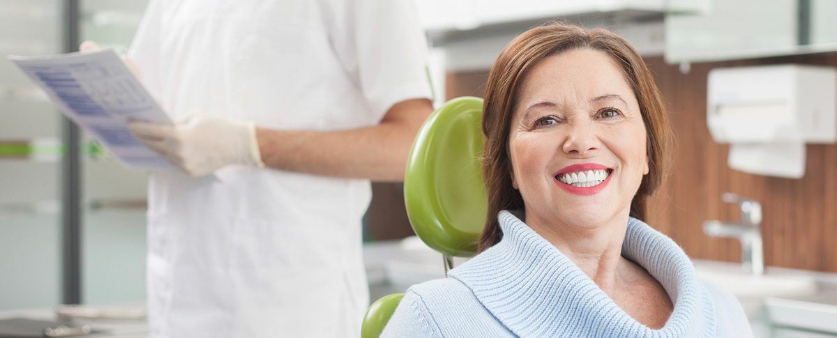 Smiling older woman in dental chair