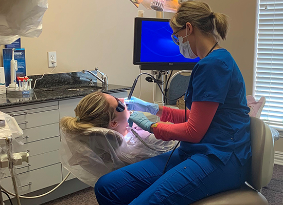 Dentist treating dental patient