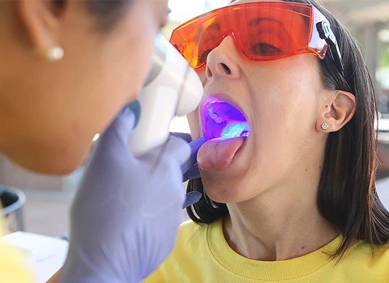 Patient receiving oral cancer screening