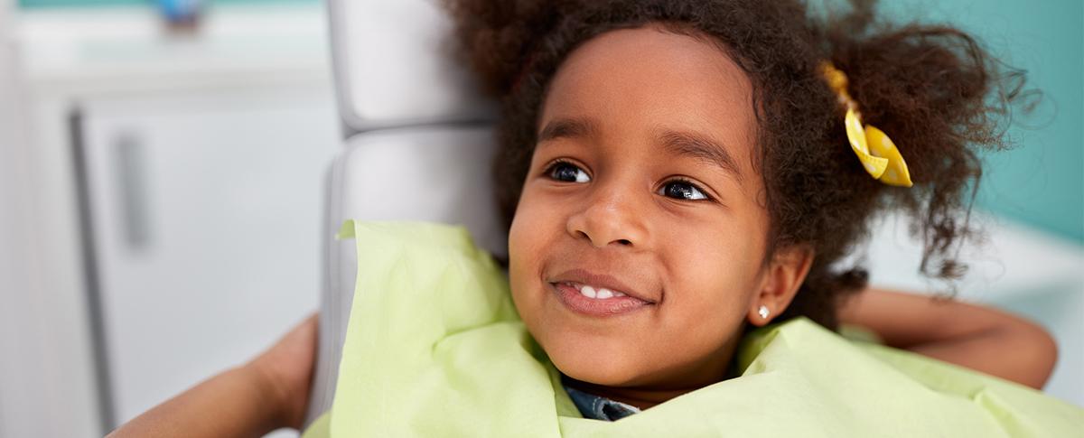 Smiling child in dental chair