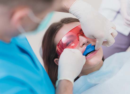 Child receiving fluoride treatment