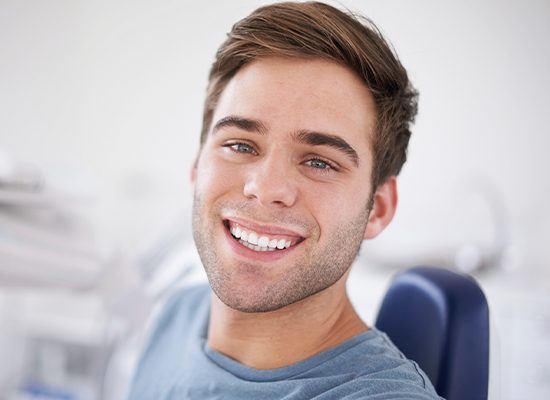 Smiling man in dental chair