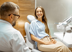 Woman smiling at cosmetic dentist in Kingwood