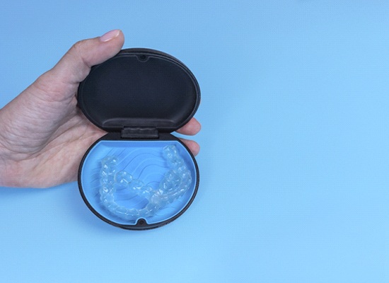 Invisalign in Kingwood in case on blue background