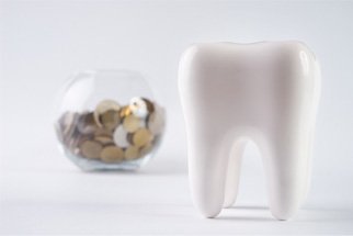 a bowl of coins behind a tooth in Kingwood