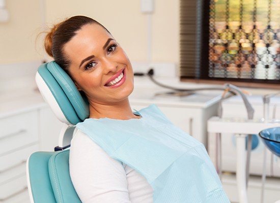 Smiling woman in dental chair