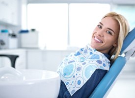 Smiling woman sitting in dental office