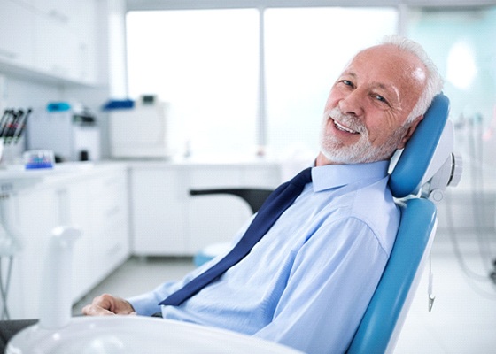 Smiling man in dentist’s chair