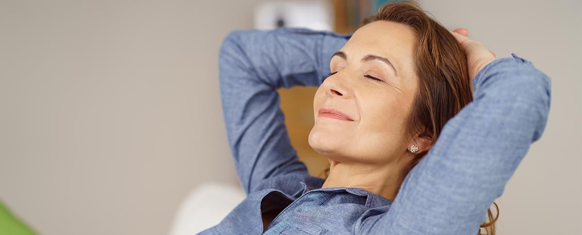 Relaxing woman with hands behind head