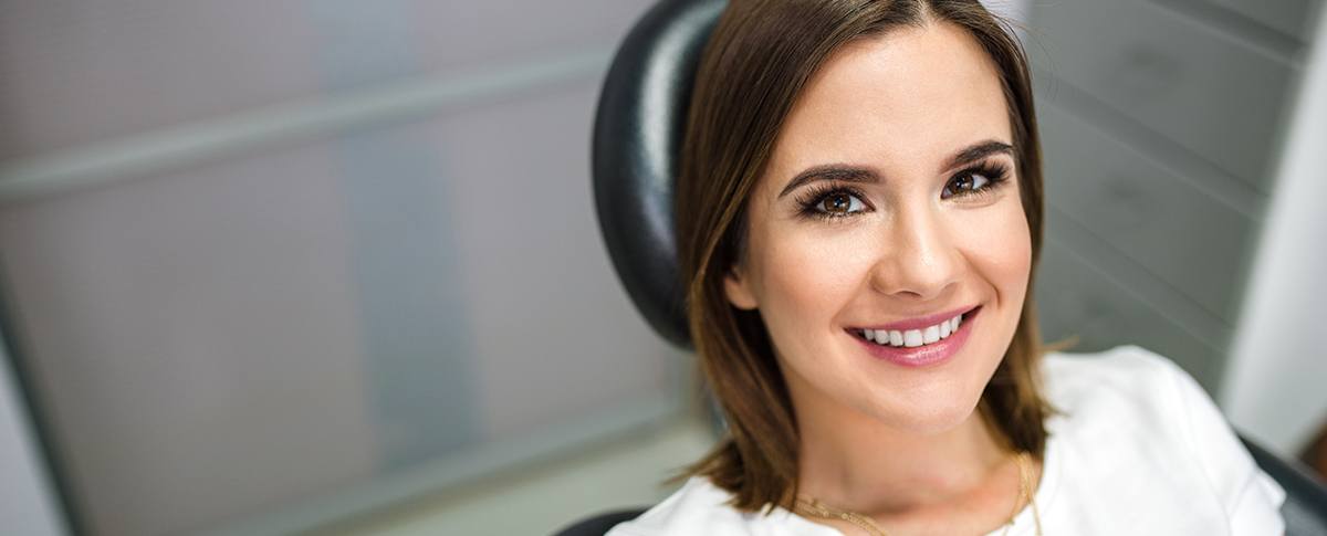 Smiling woman in dental chair