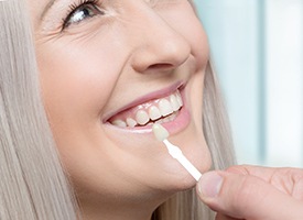 woman smiling after the cost of veneers in Kingwood