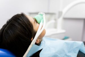 Patient being treated with nitrous oxide sedation at dentist.